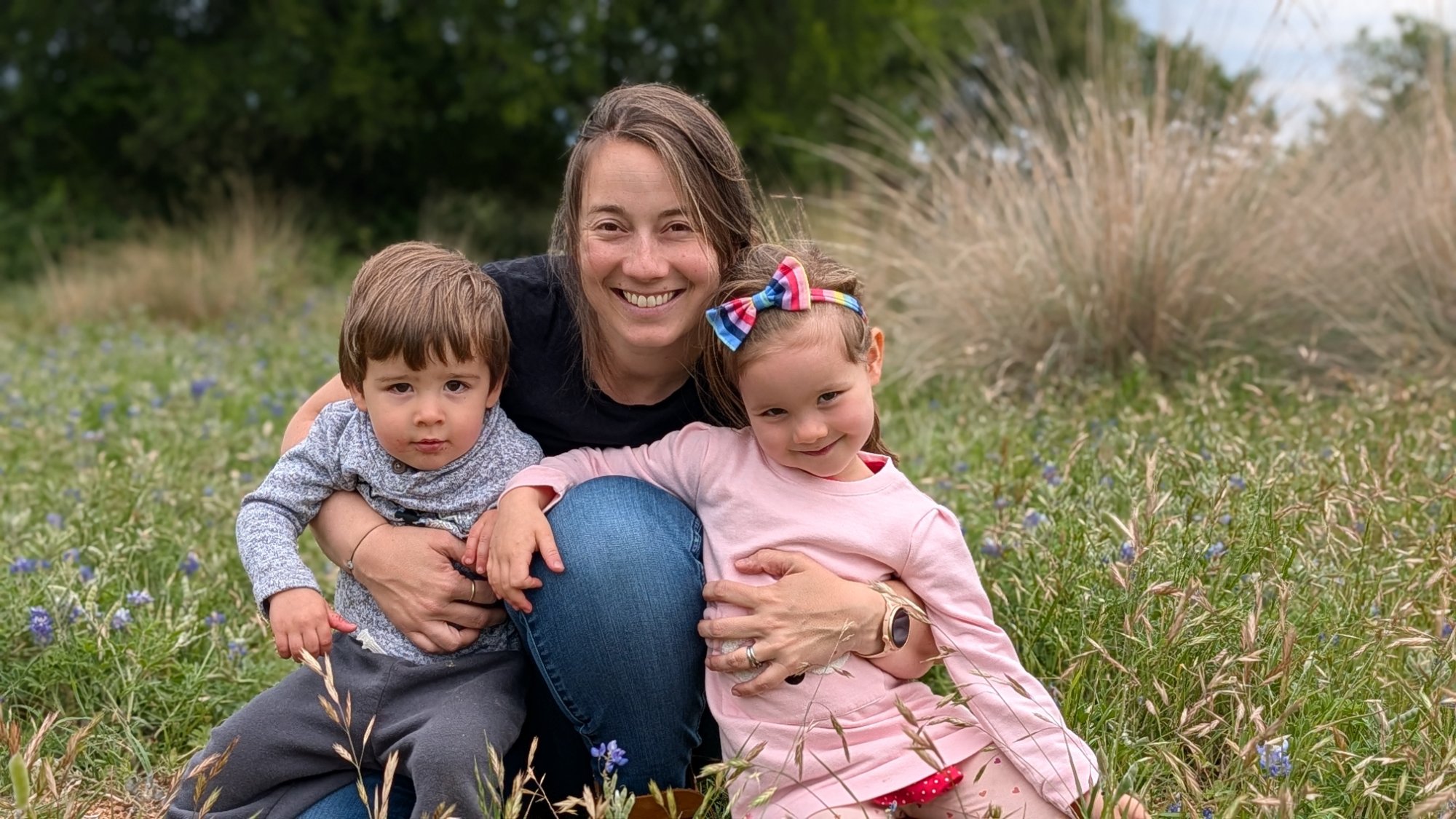 Noa with her children in bluebonnets